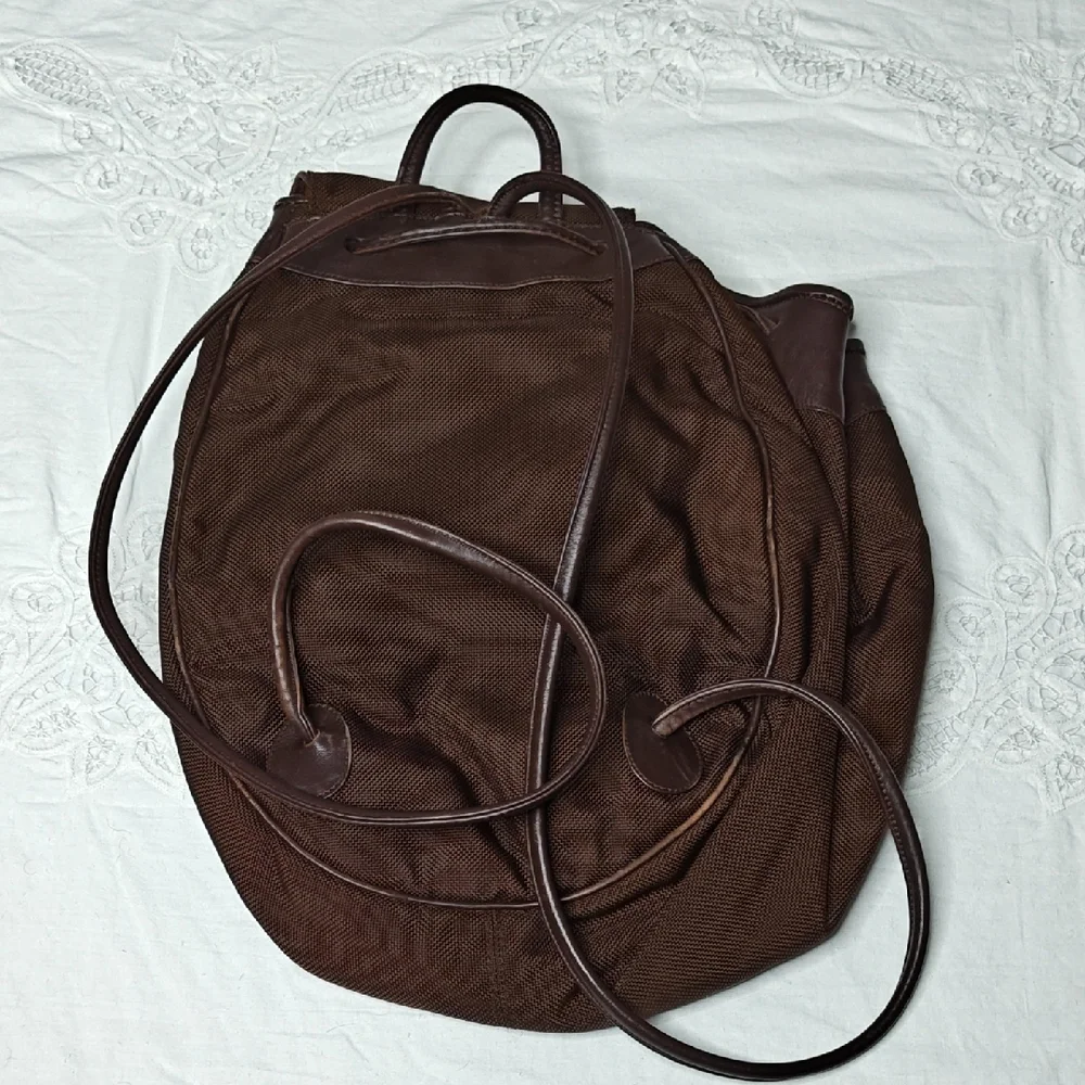 Tumi Italian Leather Drawstring Backpack Sling